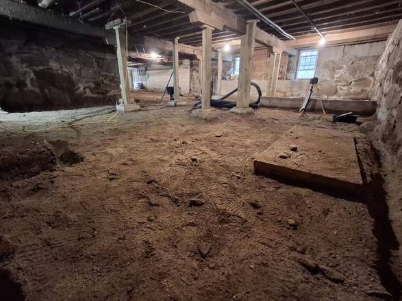 Old fieldstone basement with a dirt floor