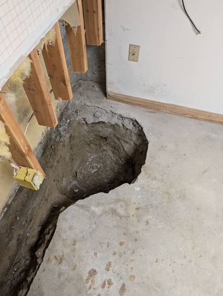 Trench along the wall leading to a new sump pit