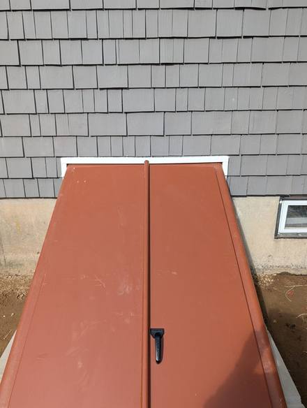 New steel bulkhead doors closed over the entry