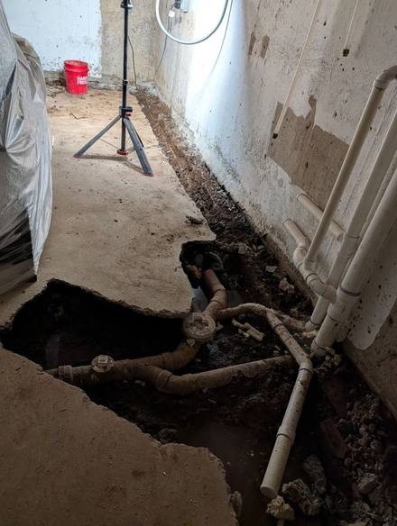 Basement slab opened along the foundation wall
